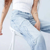 Damskie jeansy wide leg z naszywkami w kształcie serca