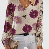Sweter damski w kwiaty z dekoltem w serek