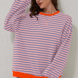 Sweter damski w paski o luźnym kroju